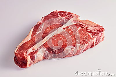 Thick tender raw t-bone steak on white Stock Photo