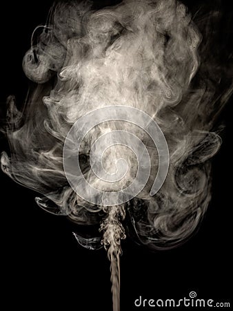 Thick white smoke isolated on a black, rising tubers upwards as an abstract effect Stock Photo