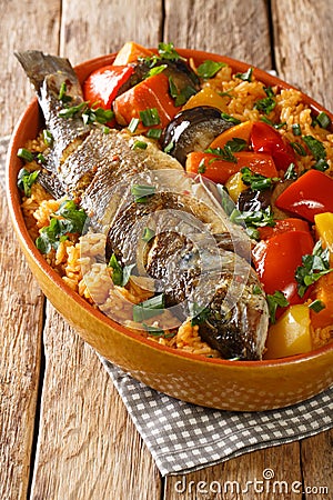 Thieboudienne Fish and Rice The National food of Senegal closeup in the dish. Vertical Stock Photo