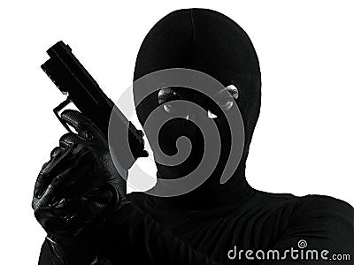 Thief criminal terrorist holding gun portrait Stock Photo