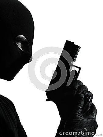 Thief criminal terrorist holding gun portrait Stock Photo