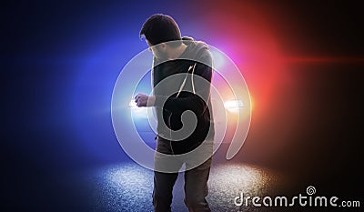 Thief is escaping and running away from police car at night. Stock Photo