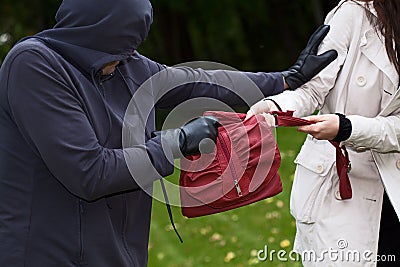 Thief in the park Stock Photo