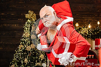 Thief Santa with bag on christmas background. Thief stole new years presents. Christmas safety from burglars and home Stock Photo