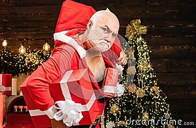 Thief Santa with bag on christmas background. Thief stole new years presents. Christmas safety from burglars and home Stock Photo