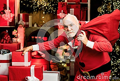 Thief stole new years presents. Criminal christmas. Criminal Santa Claus posing with a bag of christmas gifts. Stock Photo