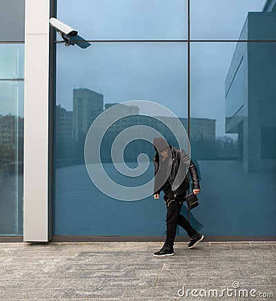 Thief stole purse and runs off Stock Photo