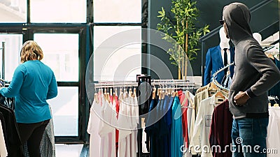 Thief stole stylish clothes in store Stock Photo