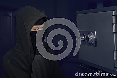 A thief thinking the lock code Stock Photo