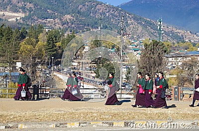 Thimphu, Bhutan - 29 February 2016: Young Bhutanese girls in uniform traditional women dress named kira, wonju long-sleeved Editorial Stock Photo