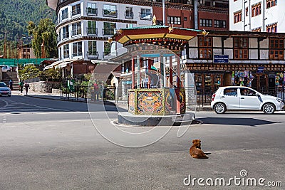 Thimphu, Bhutan - October 26, 2021: Crossroads in Thimphu. Policeman regulates the traffic. Traditional crossing hut to protect Editorial Stock Photo