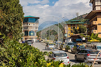 Thimphu, Bhutan - October 28, 2021: Street view Thimphu. Traditional architecture in the Bhutanese city. Cars driving on the Editorial Stock Photo