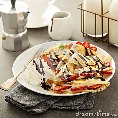 Thin crepes with cream cheese filling Stock Photo