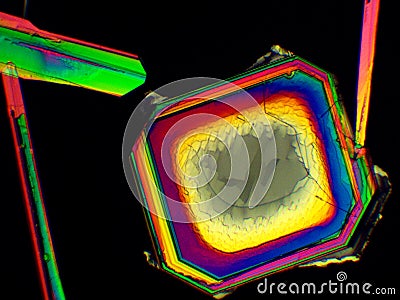 Thin layer of crystals of different chemicals seen in a microscope with polarized light Stock Photo