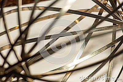 A thin metal ribbon on a light background Stock Photo