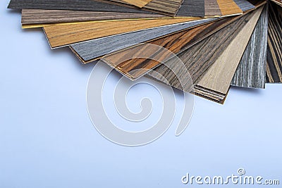 A thin sheaf of wood. Lots of samples. Interior design industry. Close up copy space. Stock Photo