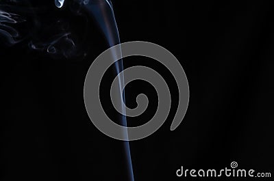 A thin stream of white smoke on a dark background with place for text, no people Stock Photo