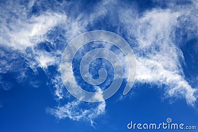 THIN WISPY CLOUD DRIFTING BY Stock Photo