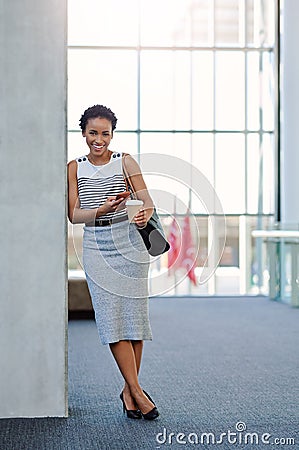 The only thing that attracts success is positivity. Full length portrait of an attractive young businesswoman smiling Stock Photo