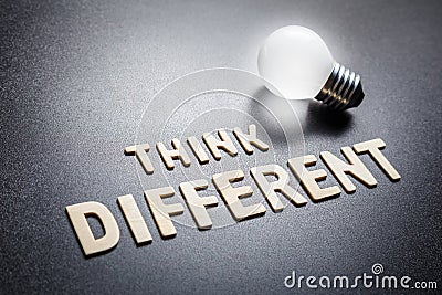 Think Different and Glowing Bulb Stock Photo