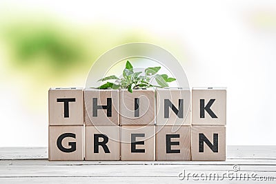 Think green sign with a plant Stock Photo