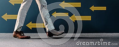 Think and Make the Different Concept. Unique Leadership. Businessman Walking Conversely the Arrow Direction. Different from Others Stock Photo