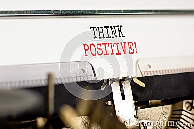 Think positive symbol. Concept words Think positive typed on beautiful old retro typewriter. Beautiful white paper background. Stock Photo