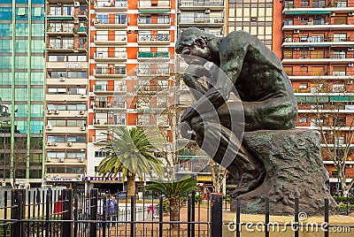 Buenos Aires, Argentina - The Thinker Statue by Rodin in front of Colorful Apartment Residential Buildings in Buenos Aires Editorial Stock Photo