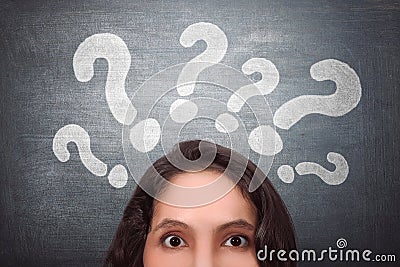 Thinking asian woman with question mark Stock Photo