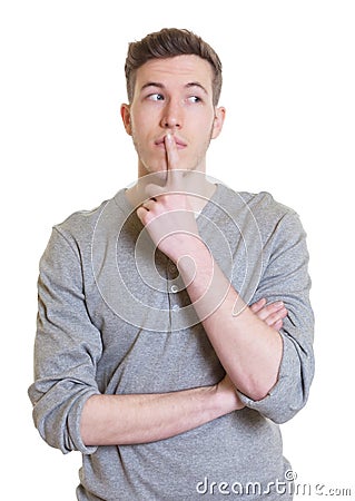 Thinking australian guy in a grey shirt looking sideways Stock Photo