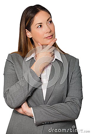 Thinking business woman holding hand under chin and arms folded Stock Photo