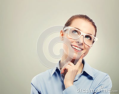 Thinking business woman wearing white eyeglasses Stock Photo