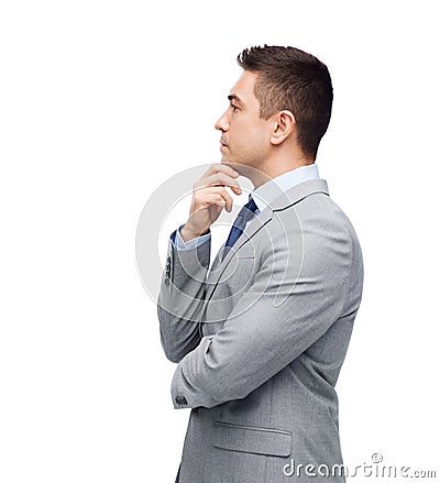 Thinking businessman in suit making decision Stock Photo