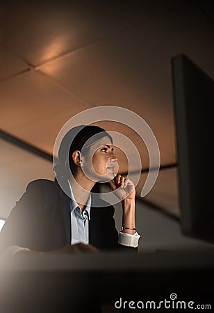 Thinking, concentration and woman in office at night reading email, proposal or online report at start up agency Stock Photo