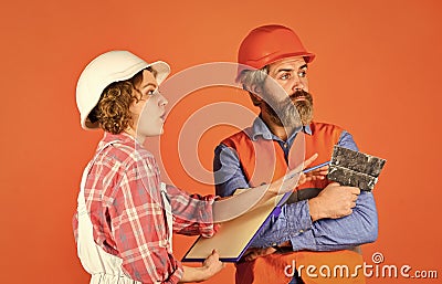 Thinking couple. renovation and people concept. Builder Couple Look At Home Plans. couple looking at a blueprint. woman Stock Photo