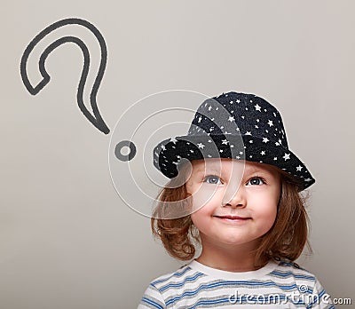 Thinking cute kid with big question sign above Stock Photo