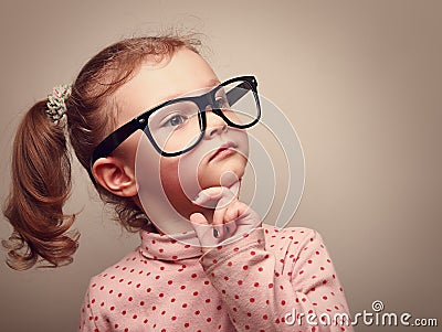 Thinking cute kid girl looking. Instagram effect Stock Photo