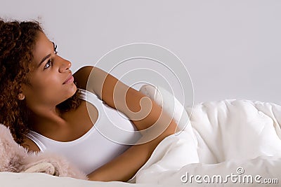 Thinking about the day in bed Stock Photo