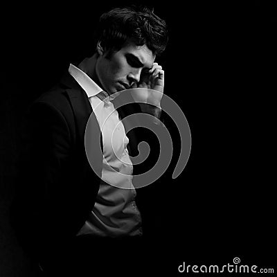 Thinking depression charismatic man looking down on dark shadow Stock Photo