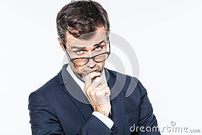 Thinking far-sighted middle aged businessman with eyeglasses down Stock Photo