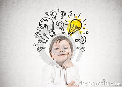 Thinking little boy, question marks, idea Stock Photo