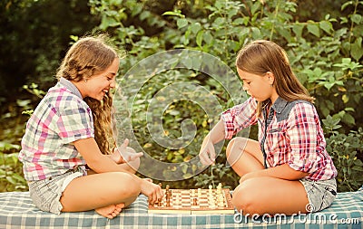 thinking process. early childhood development. worthy opponents. develop hidden abilities. two girls play chess. chess Stock Photo