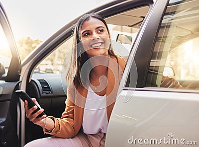 Thinking, smile and a woman in a car with a phone for communication, social media or the internet. Happy, idea and a Stock Photo