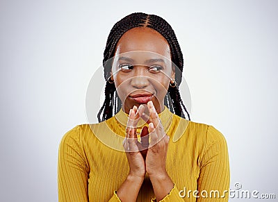 Thinking, smirk and black woman with scheme hands in studio for evil, planning or revenge on grey background. Plotting Stock Photo