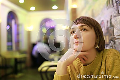 Thinking woman in cafe Stock Photo