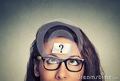 Thinking woman with question mark Stock Photo