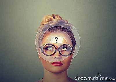 Thinking woman with question mark Stock Photo