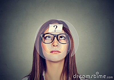 Thinking woman with question mark Stock Photo