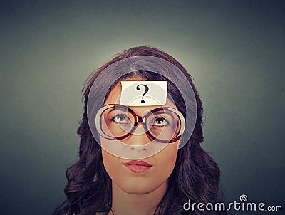 Thinking woman with question mark Stock Photo