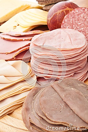 Thinly Sliced Meats on White Background Stock Photo
